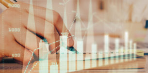 Double exposure of man doing notes of stock market with forex graph. Concept of research and trading.
